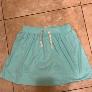 Mint green skirt. Shorts underneath.
